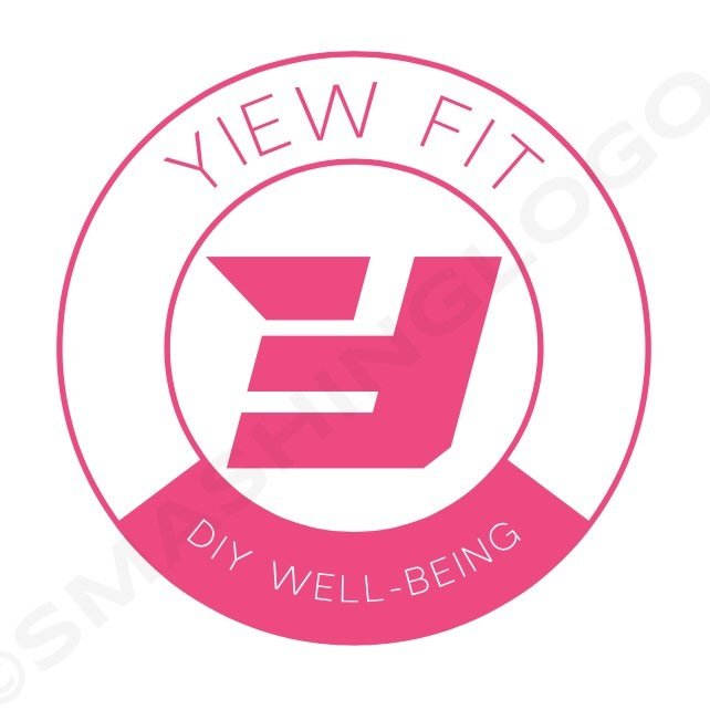 Round pink badge logo with 'VIEW FIT' at the top and 'DIY WELL-BEING' on a ribbon at the bottom, featuring a stylized pink E in the center.